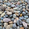 1" - 2" Round River Rock: Unwashed rounded river rock used for decoration and stream beds.